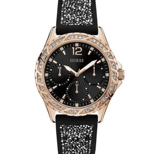 ساعة نسائية Guess Swirl Multi-Function W1096L5، بلون ذهبي وردي، إطار كريستالي، مينا أسود، وسوار مطاطي أسود مرصع بالكريستال